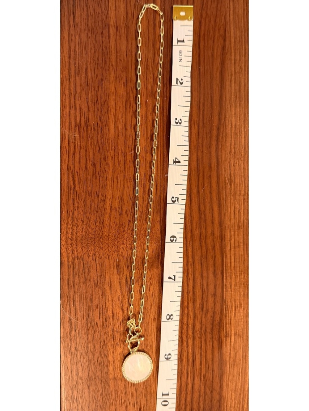 Gold Tone Chain Necklace with Mother of Pearl Pendant and Crystal Accents